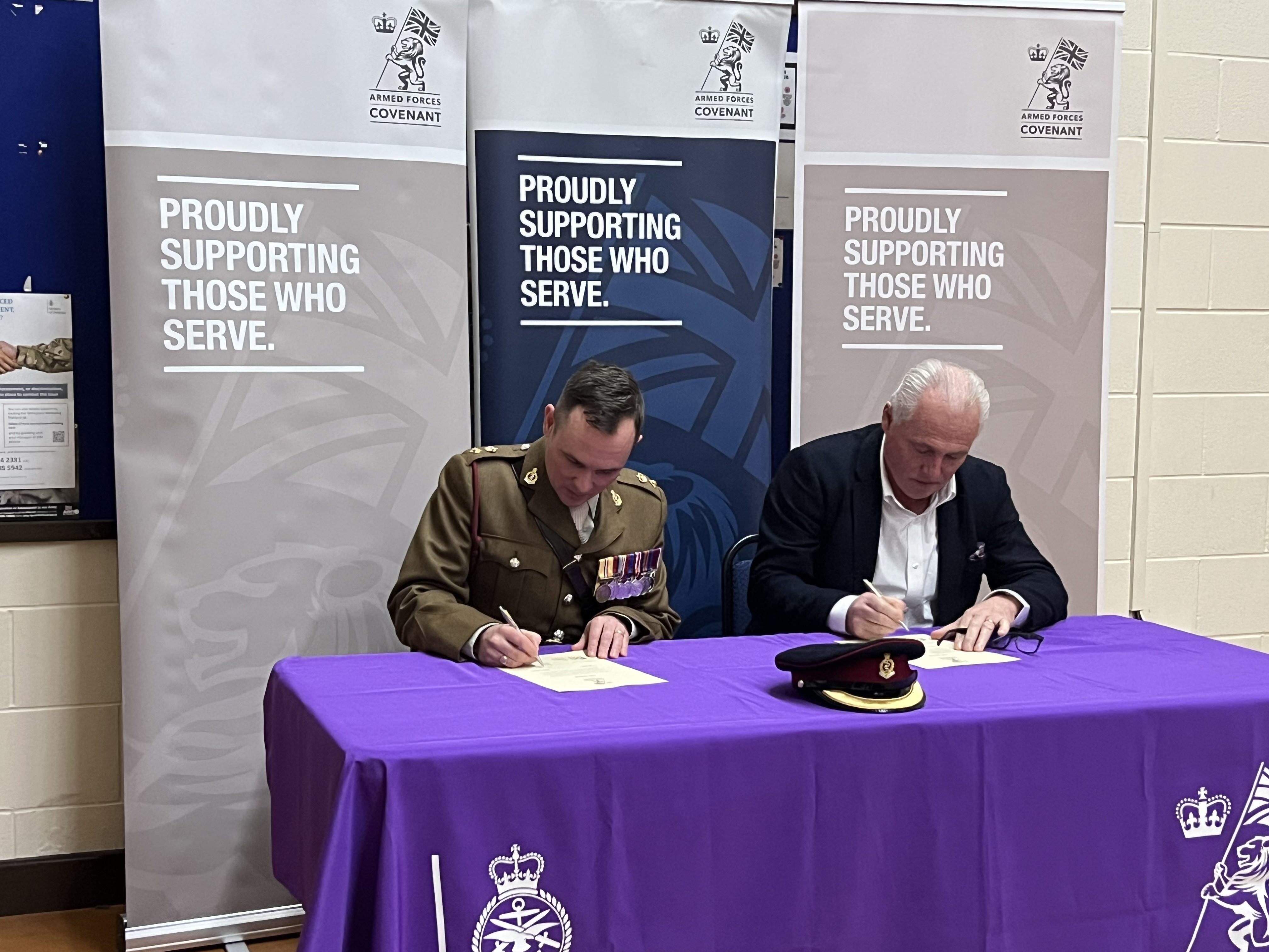 EBC Group COO, Mike Cook, signing the armed forces covenant