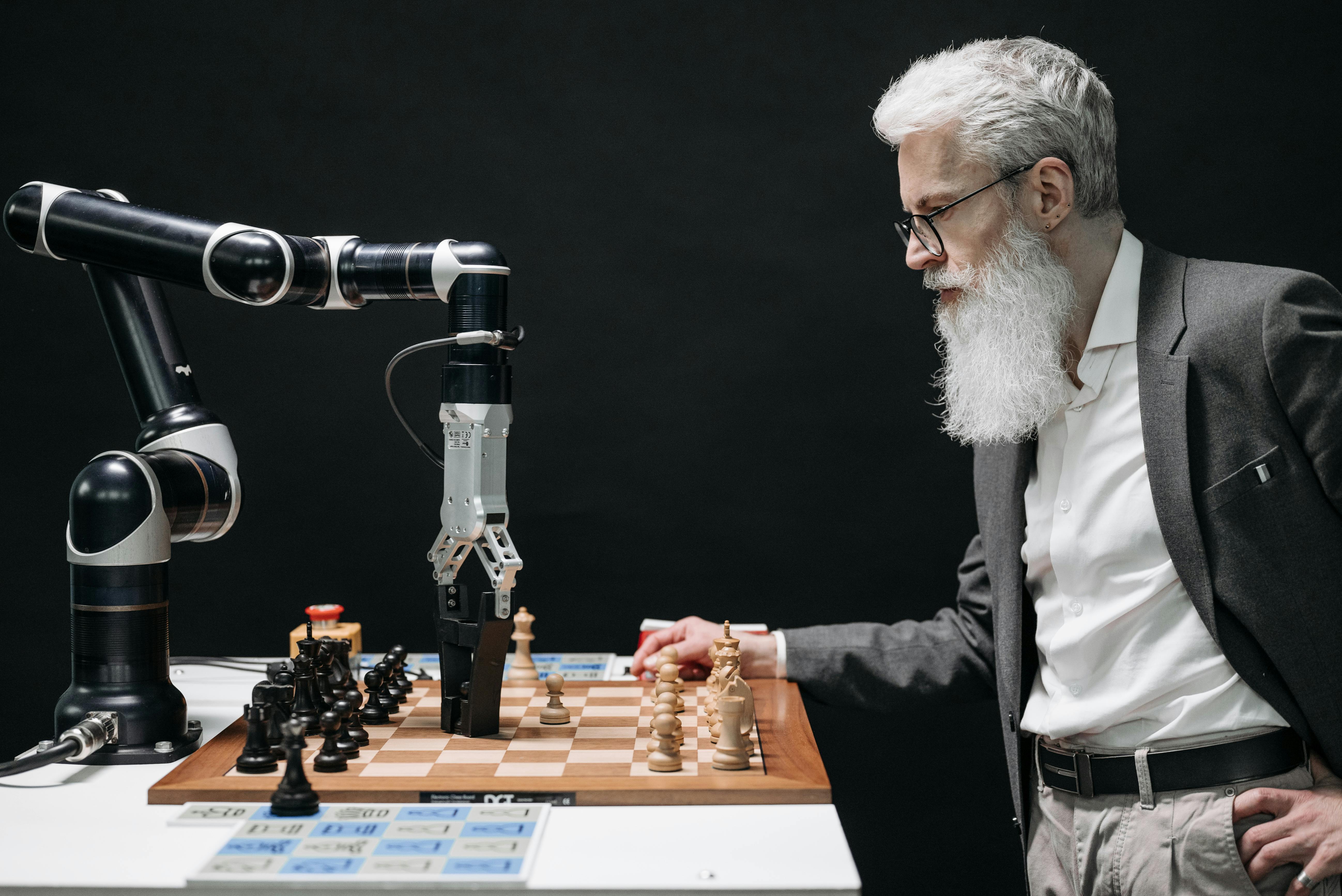 A man playing chess against an AI robot